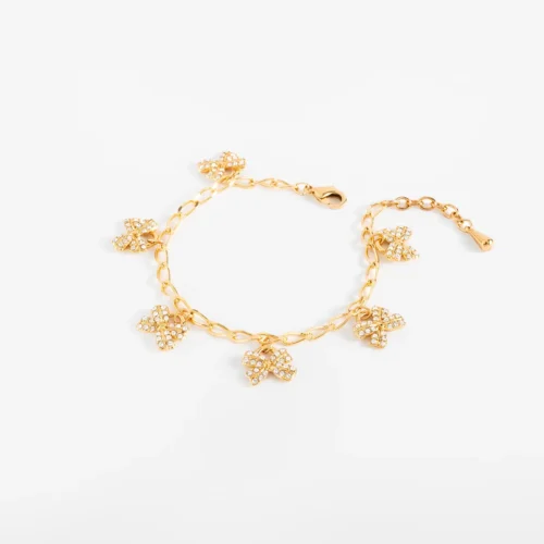 Pulsera con dijes de moño